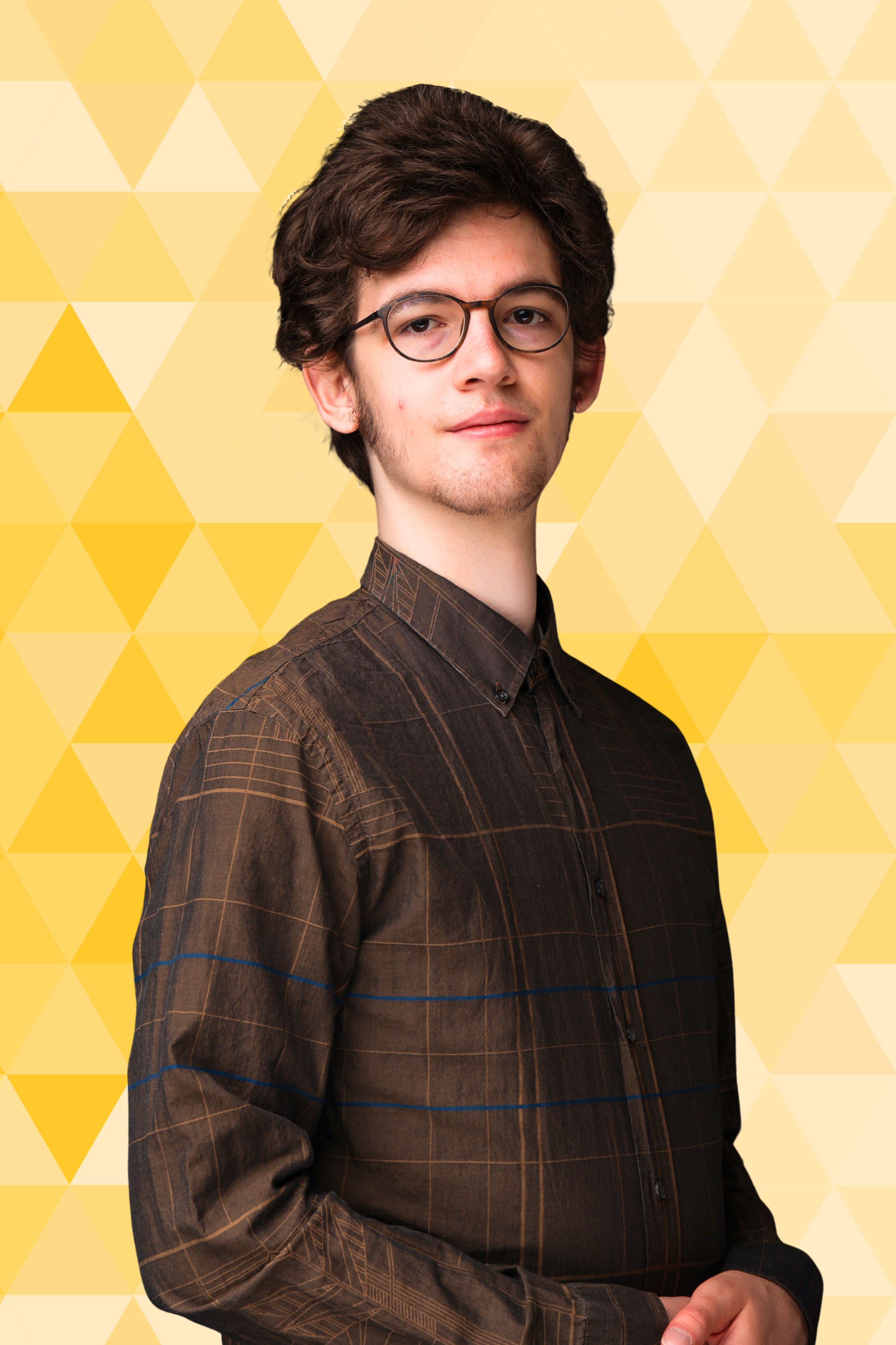 Headshot of Jacob Singleton, a person with medium-length brown hair in a purple shirt.